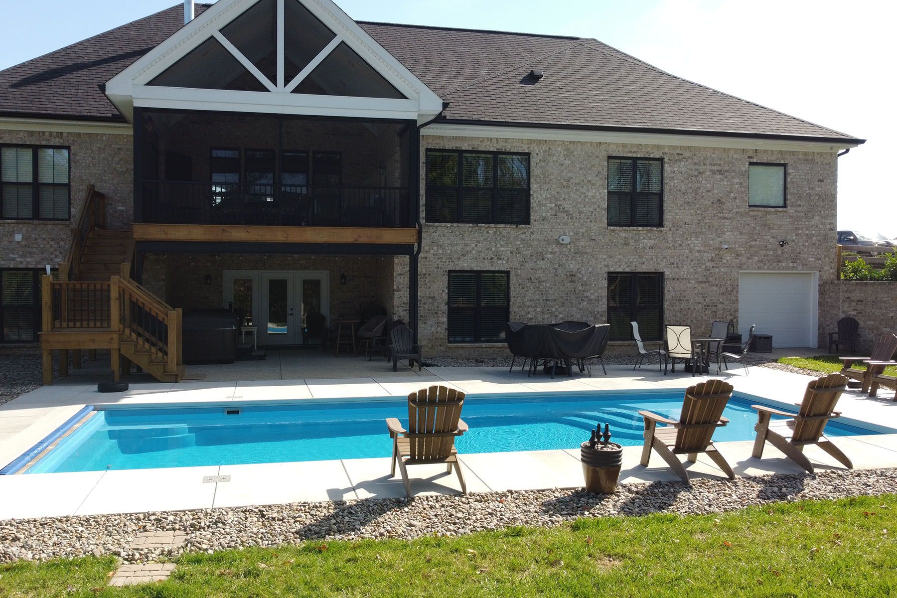 A rectangular fiberglass in-ground backyard pool in Crestwood, Kentucky.