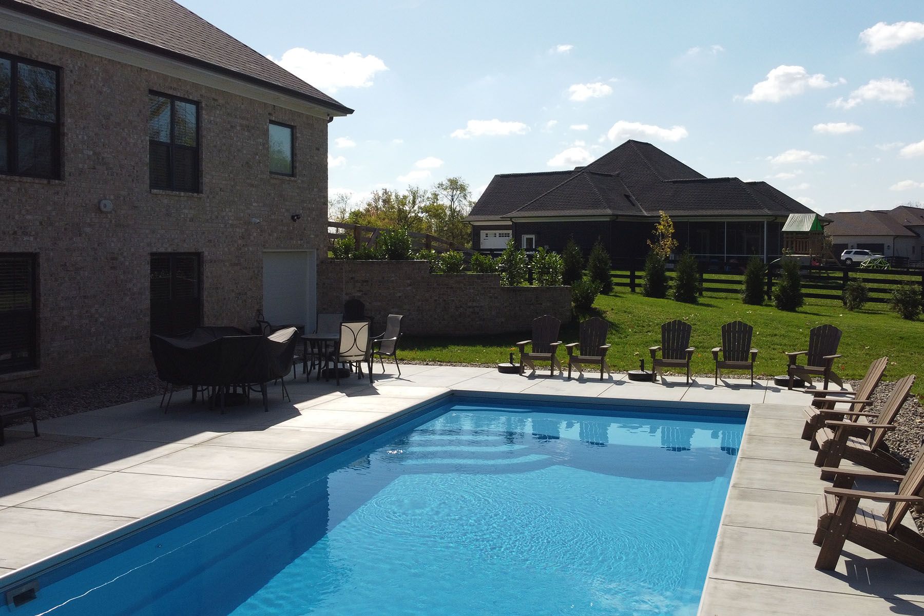 A rectangular fiberglass in-ground backyard pool in Crestwood, Kentucky.