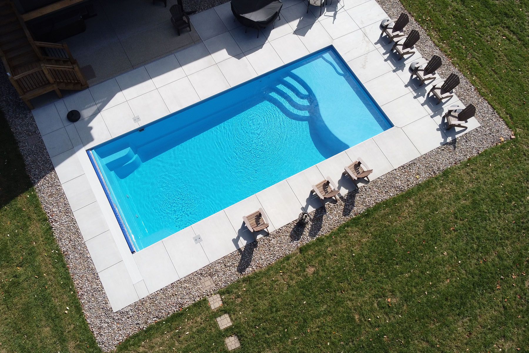 A rectangular fiberglass in-ground backyard pool in Crestwood, Kentucky.