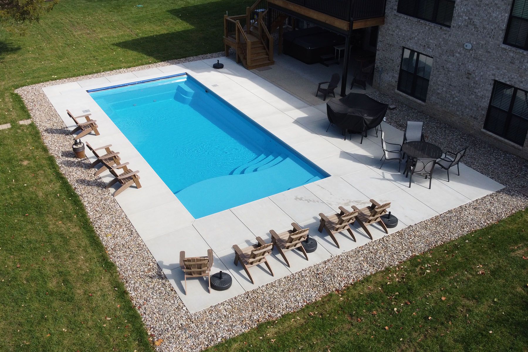 A rectangular fiberglass in-ground backyard pool in Crestwood, Kentucky.