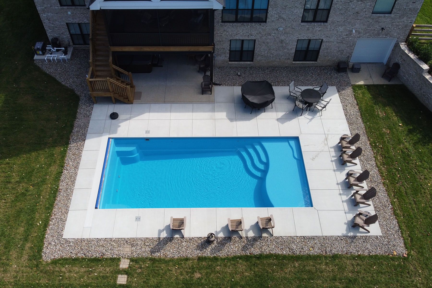 A rectangular fiberglass in-ground backyard pool in Crestwood, Kentucky.