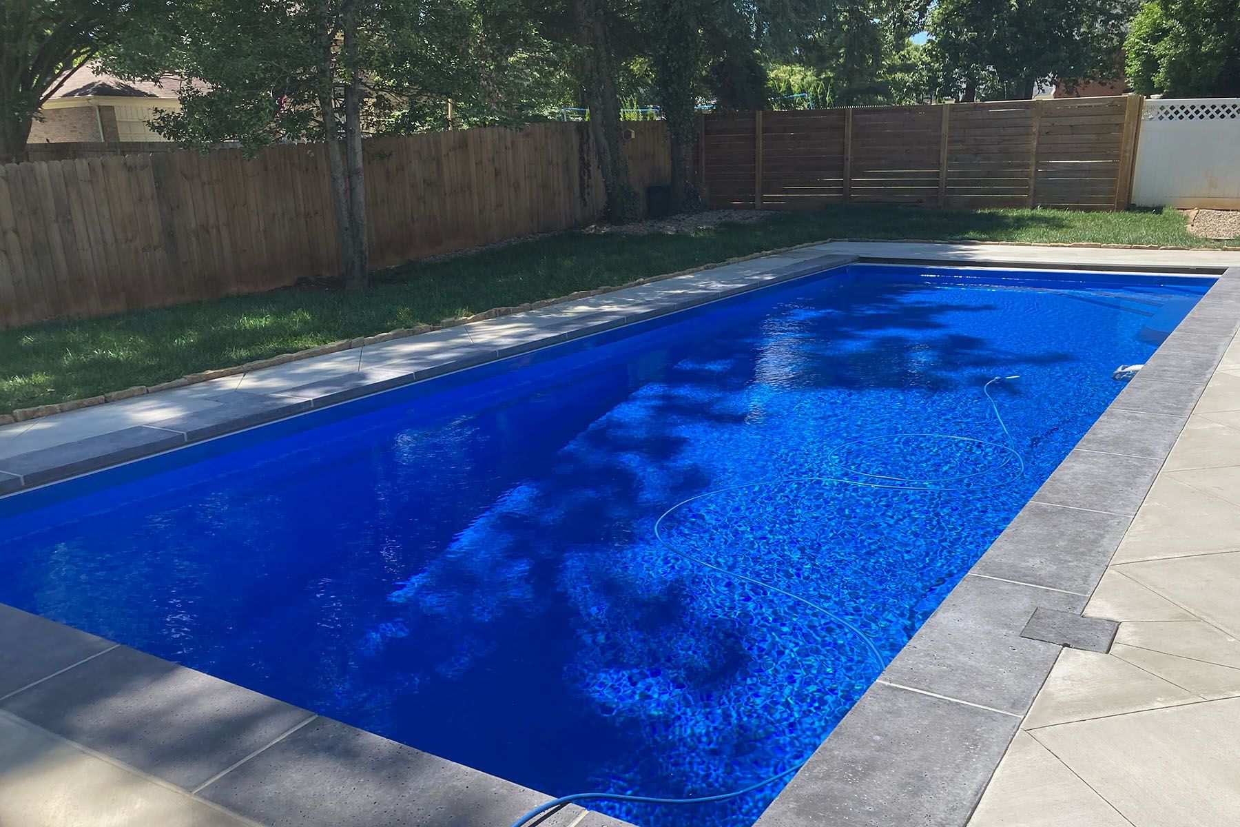 In-ground rectangle fiberglass pool in Louisville, Kentucky.