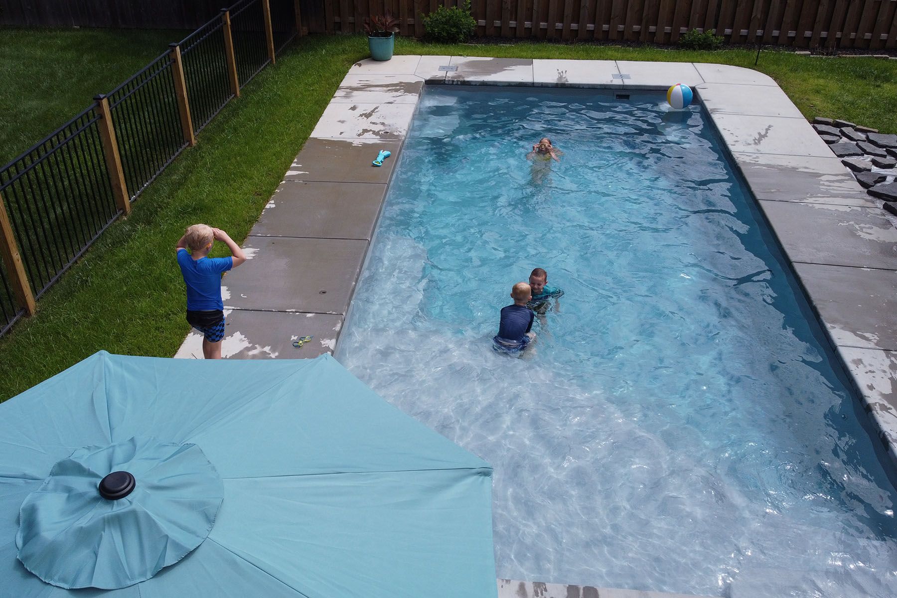 Children playing in an in-ground fiberglass swimming pool in Louisville, Kentucky.