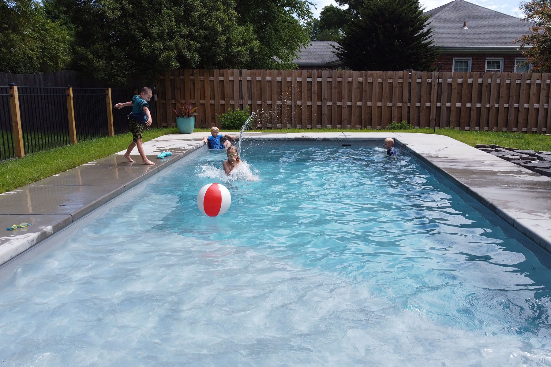 Children playing in an in-ground fiberglass swimming pool in Louisville, Kentucky.